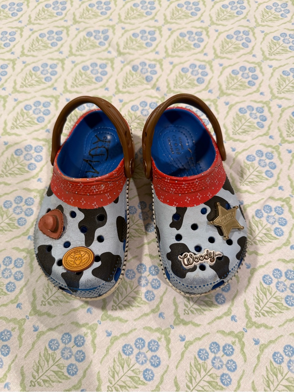 CROCS Kids Cowprint Clogs with Red Strap and Blue Insole